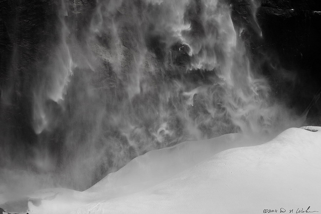 Water falling as frozen mist and forming a giant snow cone at the bottom