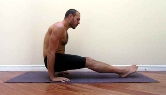 antranik demonstrating a foot supported l sit