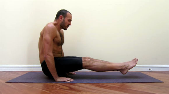 antranik demonstrating a full straight floor l sit