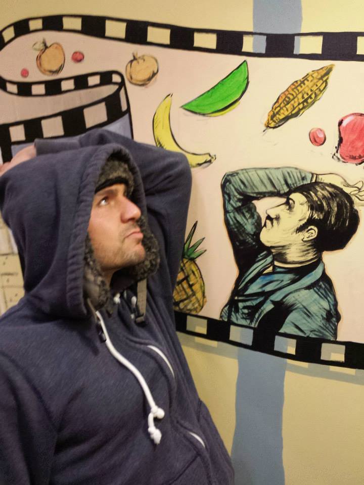 I'm at Trader Joes mocking the drawings on the walls...wearing my fluffy hat and hoodie over it for extra warmth and comfort.