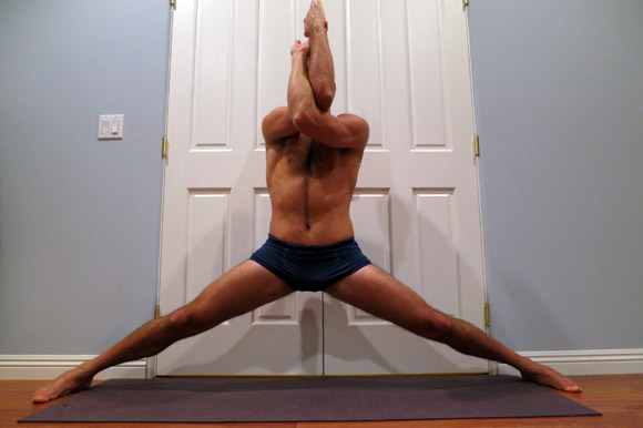 Holding middle split with eagle arms for bonus stretch.