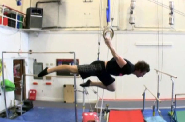 Carl Paoli demonstrating the one-knee-bent back lever, aka as the one leg back lever.